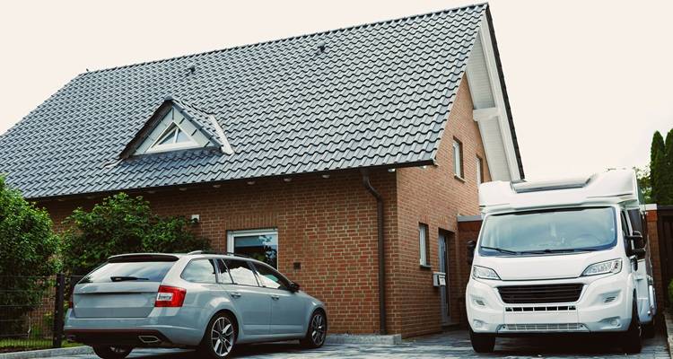 house driveway car and campervan