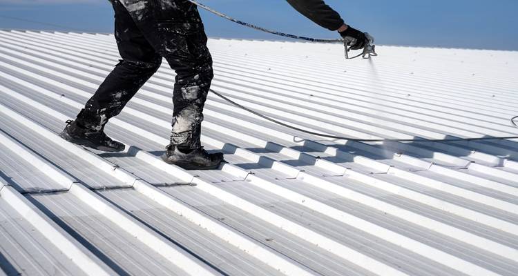white metal roof being painted