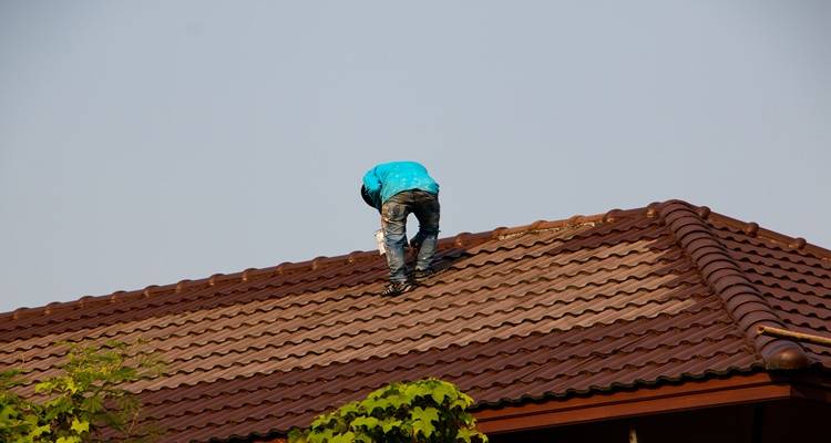 terracotta roof being painted